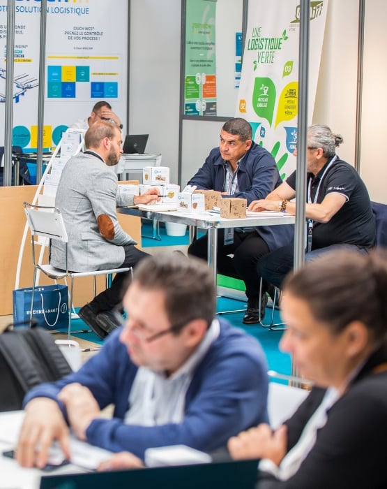  Several people discuss business at their stands