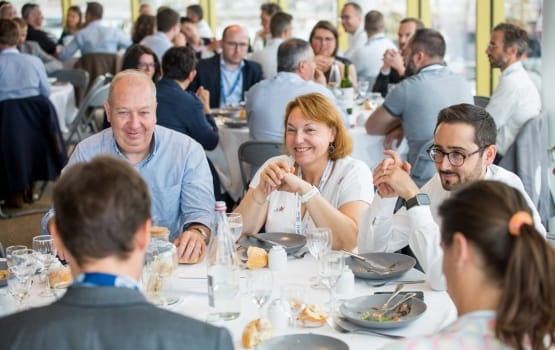 Group of smiling people having lunch 