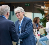 Two smiling handshakers at Top Logistics Europe