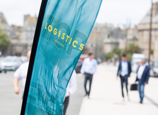 Floating banner of top logistics europe, with people in suits marching towards Quai Saint-Malo.
