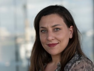 Portrait of Mégane MOKEDDEM, a professional and smiling member of the Guest Experience team.